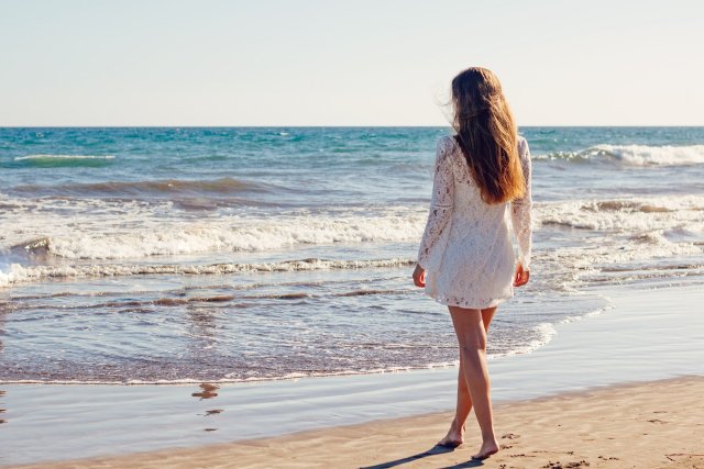 Woman walking on Seagull Beach Cape Cod